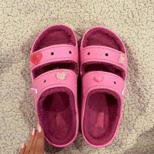 Pink fuzzy crocs slides